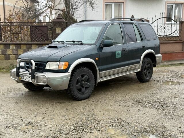 Зеленый Киа Sportage, объемом двигателя 2 л и пробегом 300 тыс. км за 3700 $, фото 1 на Automoto.ua