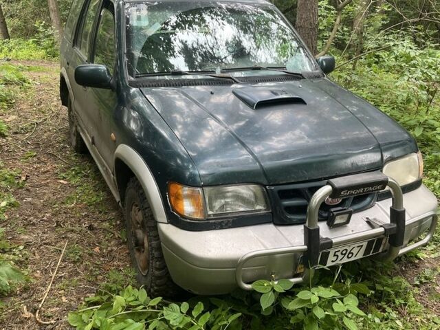 Зеленый Киа Sportage, объемом двигателя 2 л и пробегом 300 тыс. км за 3000 $, фото 1 на Automoto.ua