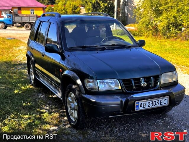 Зеленый Киа Sportage, объемом двигателя 2 л и пробегом 200 тыс. км за 3300 $, фото 1 на Automoto.ua