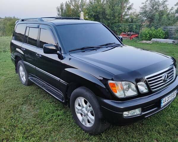Черный Лексус ЛХ, объемом двигателя 4.7 л и пробегом 430 тыс. км за 13500 $, фото 1 на Automoto.ua