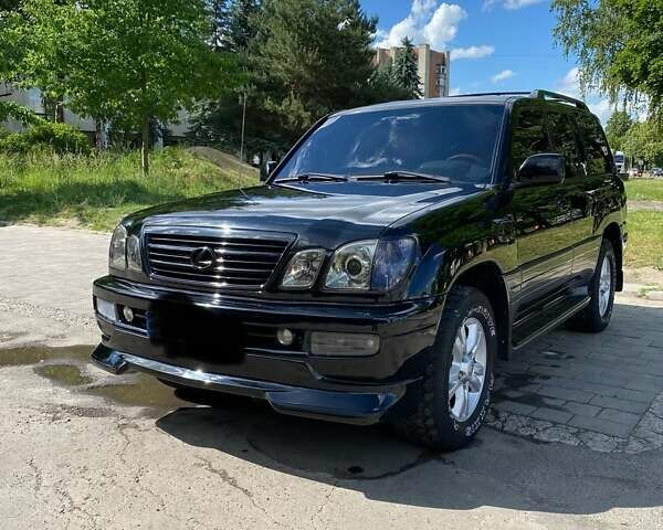 Черный Лексус ЛХ, объемом двигателя 4.7 л и пробегом 358 тыс. км за 15800 $, фото 1 на Automoto.ua