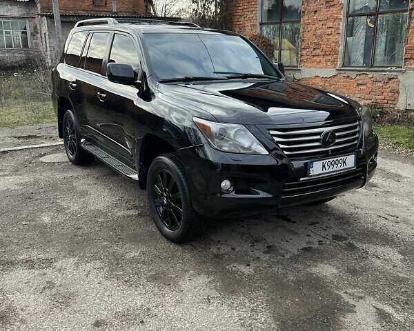 Черный Лексус ЛХ, объемом двигателя 5.66 л и пробегом 300 тыс. км за 24000 $, фото 1 на Automoto.ua