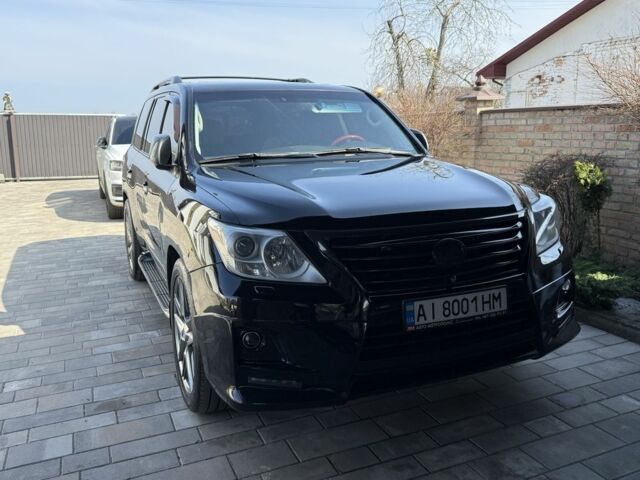 Черный Лексус ЛХ, объемом двигателя 5.7 л и пробегом 325 тыс. км за 22000 $, фото 1 на Automoto.ua