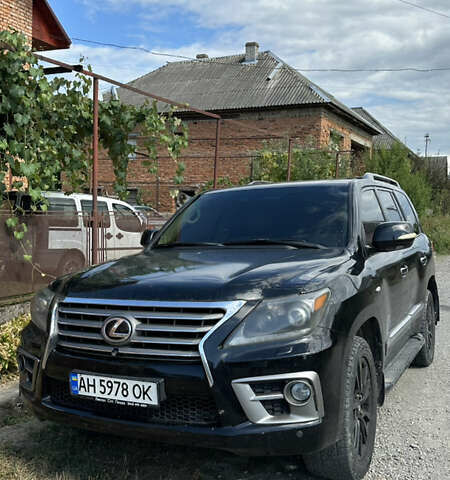 Черный Лексус ЛХ, объемом двигателя 5.66 л и пробегом 320 тыс. км за 33000 $, фото 1 на Automoto.ua