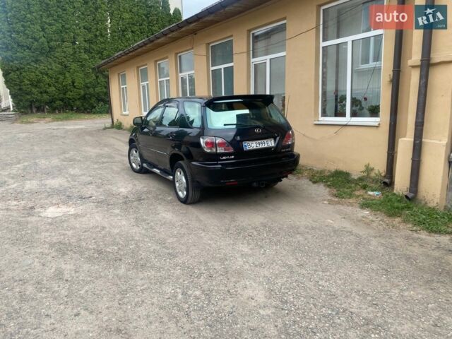 Черный Лексус РХ, объемом двигателя 3 л и пробегом 215 тыс. км за 7900 $, фото 1 на Automoto.ua