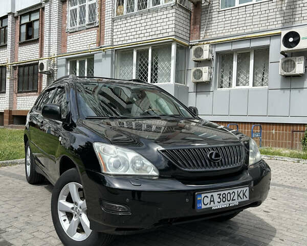 Черный Лексус РХ, объемом двигателя 3.46 л и пробегом 250 тыс. км за 9500 $, фото 1 на Automoto.ua