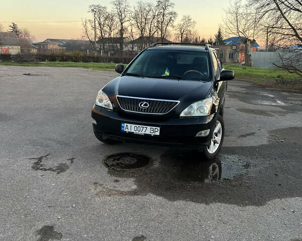 Черный Лексус РХ, объемом двигателя 3.5 л и пробегом 260 тыс. км за 13999 $, фото 1 на Automoto.ua