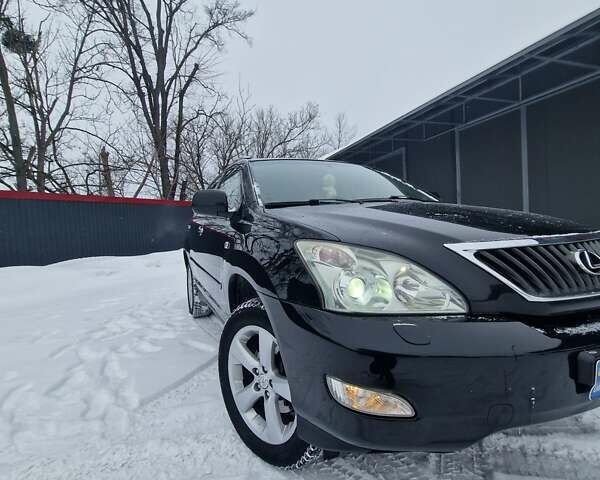Черный Лексус РХ, объемом двигателя 3.46 л и пробегом 161 тыс. км за 11500 $, фото 1 на Automoto.ua