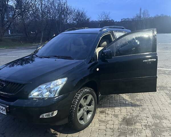 Черный Лексус РХ, объемом двигателя 3.46 л и пробегом 167 тыс. км за 12000 $, фото 1 на Automoto.ua