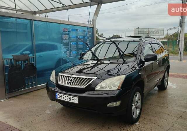 Черный Лексус РХ, объемом двигателя 3.46 л и пробегом 235 тыс. км за 13300 $, фото 1 на Automoto.ua