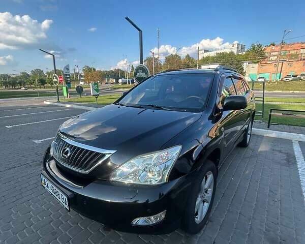 Черный Лексус РХ, объемом двигателя 3.46 л и пробегом 242 тыс. км за 14000 $, фото 1 на Automoto.ua