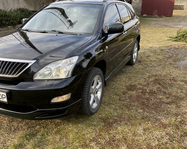 Черный Лексус РХ, объемом двигателя 3.46 л и пробегом 167 тыс. км за 13800 $, фото 1 на Automoto.ua