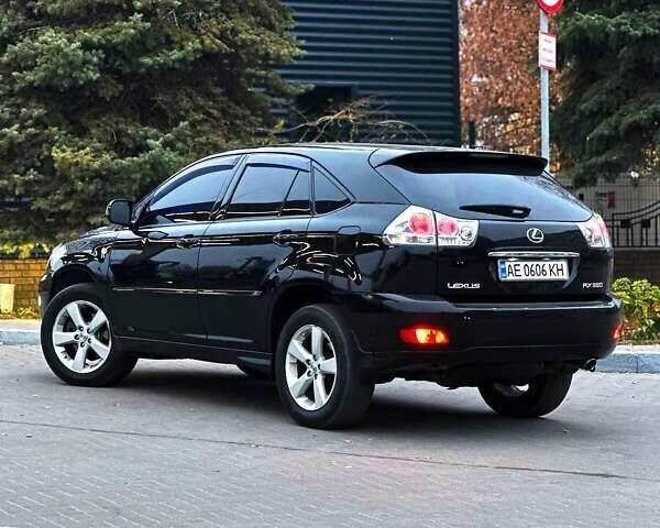 Черный Лексус РХ, объемом двигателя 3.5 л и пробегом 233 тыс. км за 11499 $, фото 1 на Automoto.ua