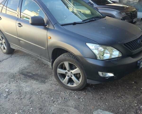 Черный Лексус РХ, объемом двигателя 3.46 л и пробегом 300 тыс. км за 7200 $, фото 1 на Automoto.ua