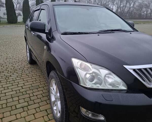 Черный Лексус РХ, объемом двигателя 3.46 л и пробегом 260 тыс. км за 11000 $, фото 1 на Automoto.ua