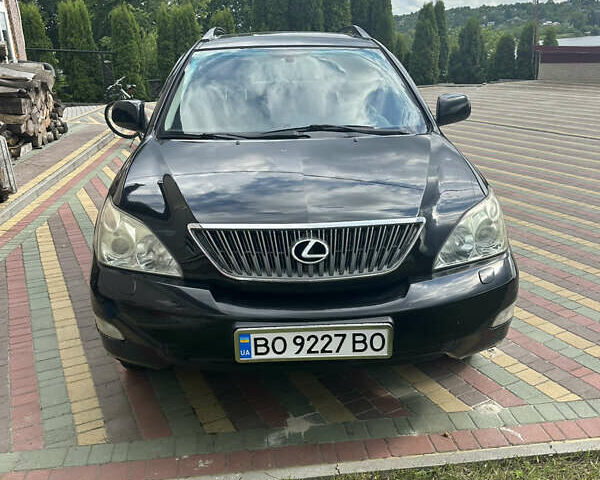 Черный Лексус РХ, объемом двигателя 3.51 л и пробегом 225 тыс. км за 12000 $, фото 1 на Automoto.ua