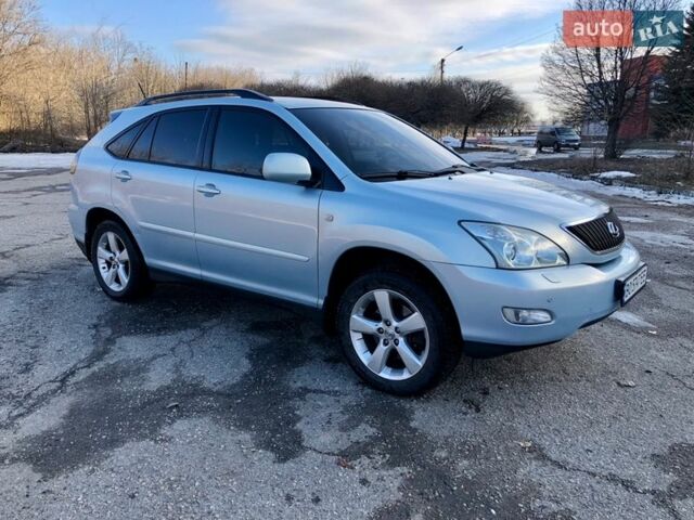 Синій Лексус РХ, об'ємом двигуна 3.46 л та пробігом 244 тис. км за 8700 $, фото 1 на Automoto.ua