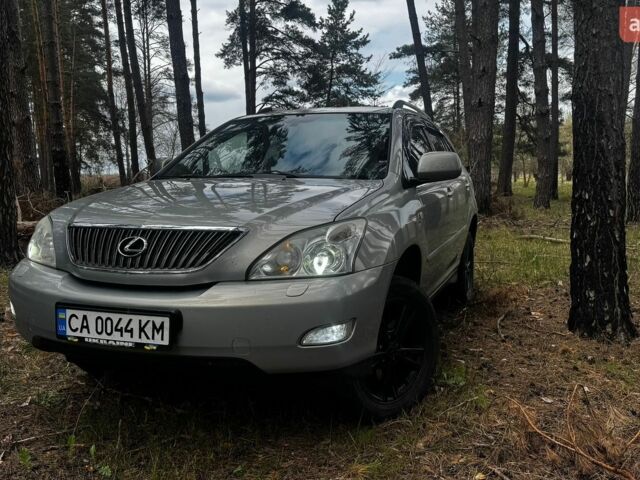 Зеленый Лексус РХ, объемом двигателя 3.46 л и пробегом 301 тыс. км за 12500 $, фото 1 на Automoto.ua