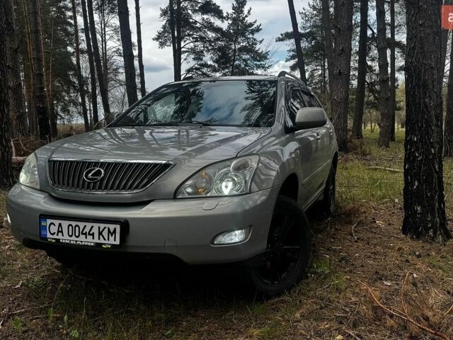 Зеленый Лексус РХ, объемом двигателя 3.46 л и пробегом 301 тыс. км за 12500 $, фото 1 на Automoto.ua