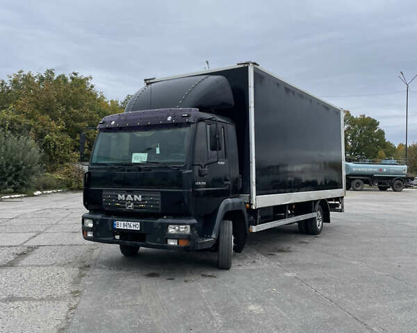 Черный МАН 8.150 груз., объемом двигателя 4.6 л и пробегом 700 тыс. км за 11000 $, фото 1 на Automoto.ua