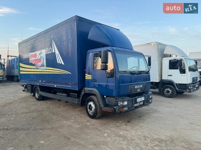Синий МАН Л 2000, объемом двигателя 4.58 л и пробегом 900 тыс. км за 10000 $, фото 1 на Automoto.ua