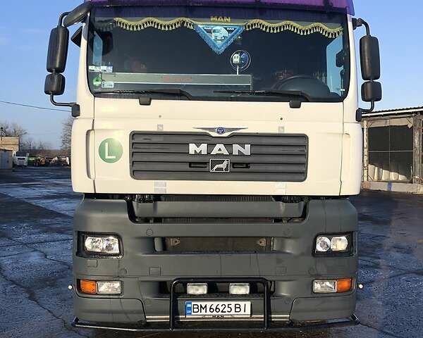 Белый МАН ТГА, объемом двигателя 11.9 л и пробегом 980 тыс. км за 11000 $, фото 1 на Automoto.ua