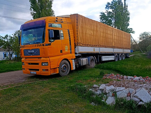 Желтый МАН ТГА, объемом двигателя 12.8 л и пробегом 2000 тыс. км за 8000 $, фото 1 на Automoto.ua