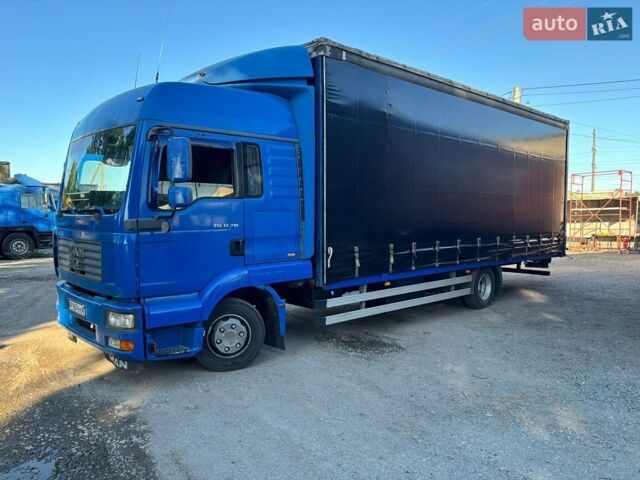 Синий МАН ТГЛ, объемом двигателя 4.6 л и пробегом 985 тыс. км за 17500 $, фото 1 на Automoto.ua