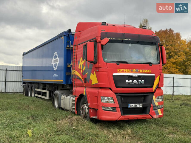 Красный МАН ТГКС, объемом двигателя 10.52 л и пробегом 900 тыс. км за 12000 $, фото 1 на Automoto.ua