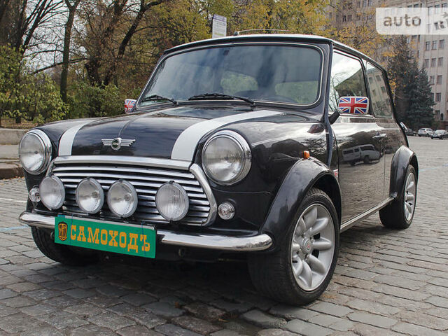 Чорний Міні Cooper, об'ємом двигуна 1.3 л та пробігом 38 тис. км за 18000 $, фото 1 на Automoto.ua