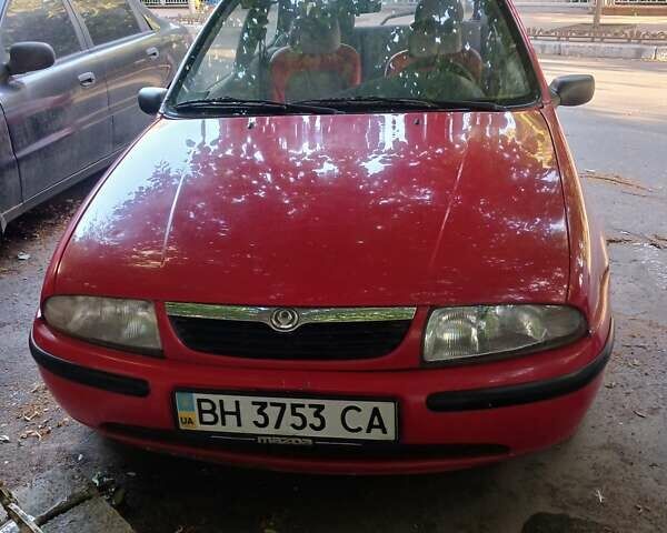 Червоний Мазда 121, об'ємом двигуна 1.3 л та пробігом 300 тис. км за 1500 $, фото 1 на Automoto.ua