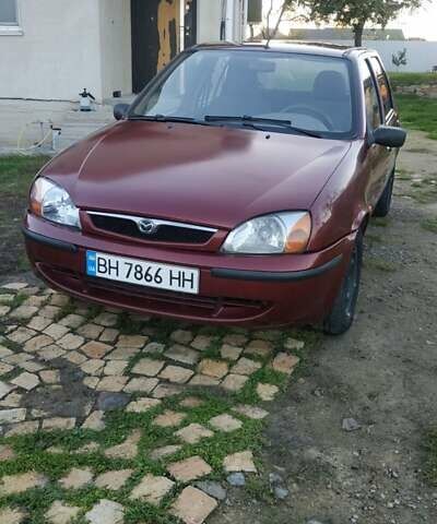 Красный Мазда 121, объемом двигателя 1.3 л и пробегом 185 тыс. км за 1850 $, фото 1 на Automoto.ua
