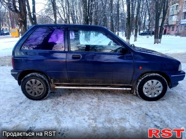 Синий Мазда 121, объемом двигателя 1.3 л и пробегом 152 тыс. км за 1450 $, фото 1 на Automoto.ua