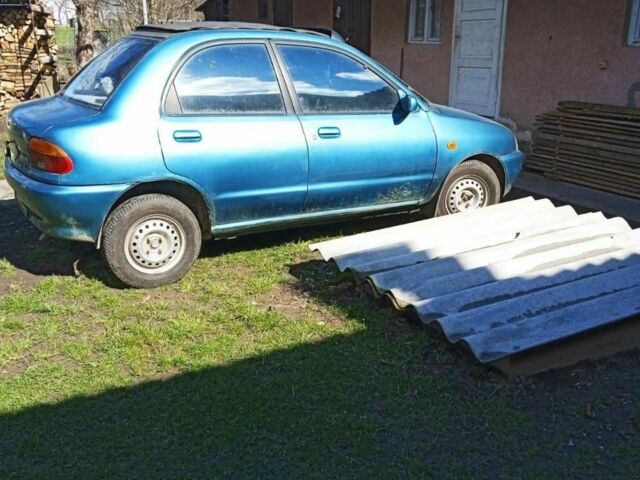 Синий Мазда 121, объемом двигателя 1 л и пробегом 406 тыс. км за 1350 $, фото 1 на Automoto.ua