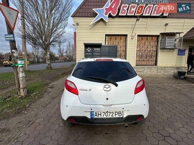 Белый Мазда 2, объемом двигателя 1.4 л и пробегом 100 тыс. км за 4800 $, фото 1 на Automoto.ua