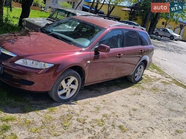 Черный Мазда 2, объемом двигателя 2 л и пробегом 315 тыс. км за 3600 $, фото 1 на Automoto.ua