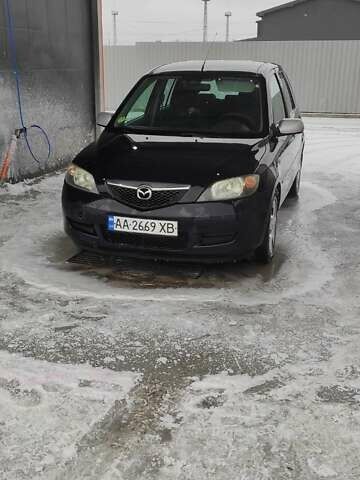 Чорний Мазда 2, об'ємом двигуна 1.4 л та пробігом 262 тис. км за 4485 $, фото 1 на Automoto.ua