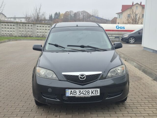 Черный Мазда 2, объемом двигателя 1.4 л и пробегом 240 тыс. км за 3500 $, фото 1 на Automoto.ua