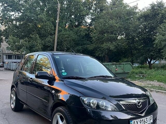 Чорний Мазда 2, об'ємом двигуна 1.39 л та пробігом 237 тис. км за 4300 $, фото 1 на Automoto.ua