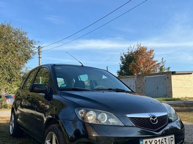 Чорний Мазда 2, об'ємом двигуна 1.39 л та пробігом 238 тис. км за 3550 $, фото 1 на Automoto.ua