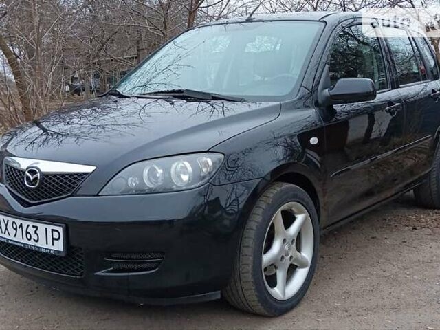 Чорний Мазда 2, об'ємом двигуна 1.4 л та пробігом 211 тис. км за 3900 $, фото 1 на Automoto.ua