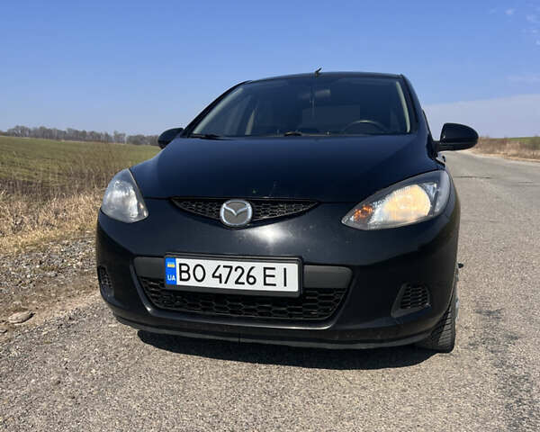 Черный Мазда 2, объемом двигателя 1.3 л и пробегом 250 тыс. км за 4200 $, фото 1 на Automoto.ua