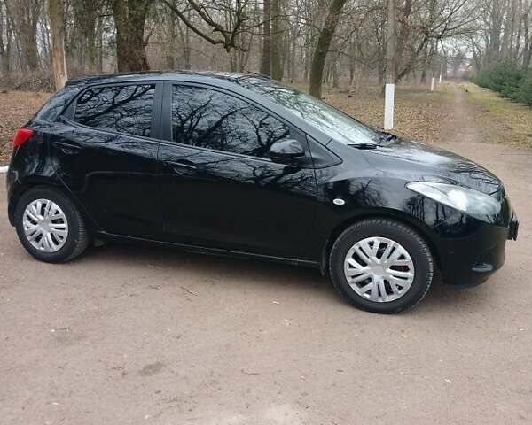 Черный Мазда 2, объемом двигателя 1.3 л и пробегом 260 тыс. км за 4150 $, фото 1 на Automoto.ua