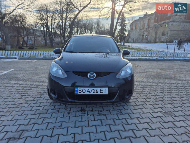 Черный Мазда 2, объемом двигателя 1.35 л и пробегом 233 тыс. км за 5300 $, фото 1 на Automoto.ua
