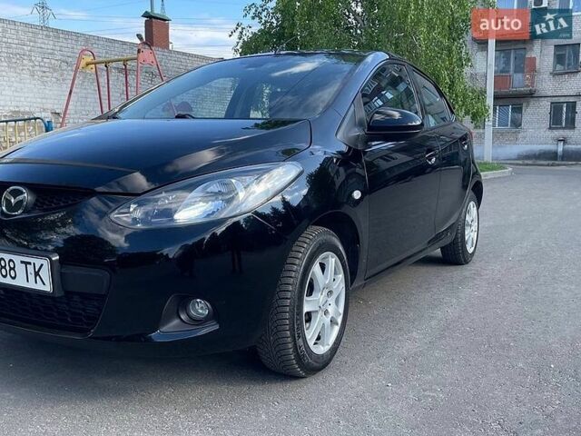 Черный Мазда 2, объемом двигателя 1.5 л и пробегом 185 тыс. км за 4799 $, фото 1 на Automoto.ua