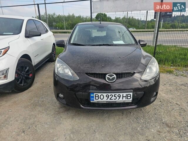 Черный Мазда 2, объемом двигателя 1.5 л и пробегом 185 тыс. км за 6800 $, фото 1 на Automoto.ua