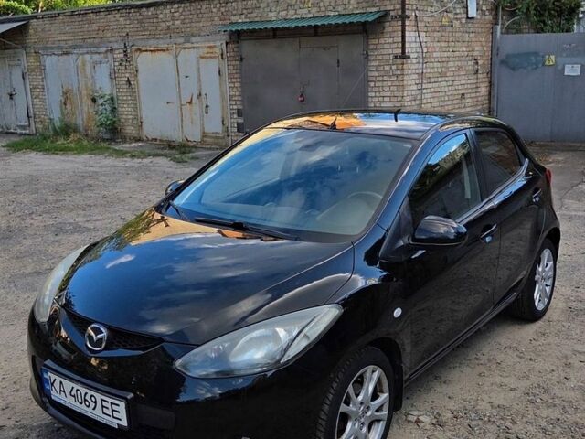 Черный Мазда 2, объемом двигателя 1.5 л и пробегом 156 тыс. км за 5300 $, фото 1 на Automoto.ua