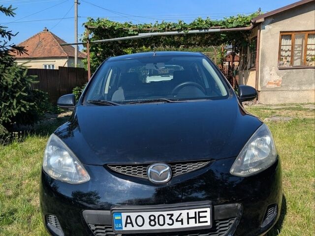 Чорний Мазда 2, об'ємом двигуна 1.35 л та пробігом 244 тис. км за 4800 $, фото 1 на Automoto.ua