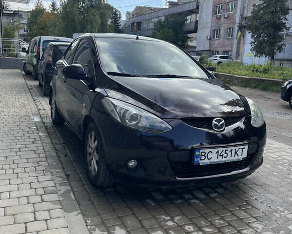 Черный Мазда 2, объемом двигателя 1.5 л и пробегом 145 тыс. км за 5750 $, фото 1 на Automoto.ua