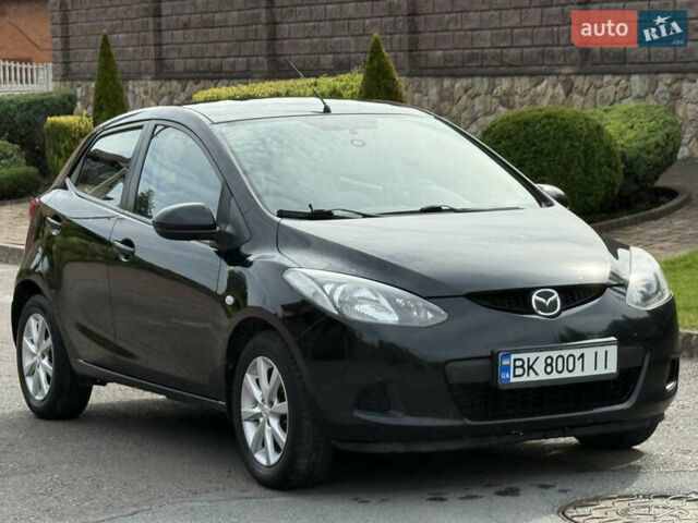 Чорний Мазда 2, об'ємом двигуна 1.35 л та пробігом 197 тис. км за 4997 $, фото 1 на Automoto.ua